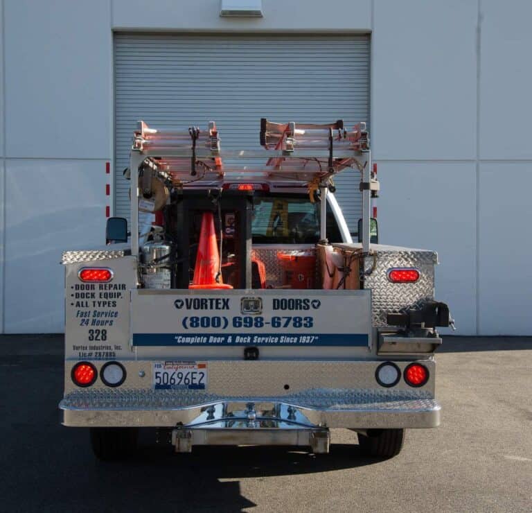 Vortex truck in front of rollup door