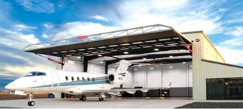 Airplane in front of hangar