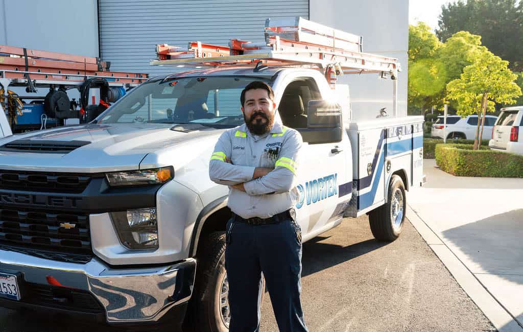 Service person next to truck
