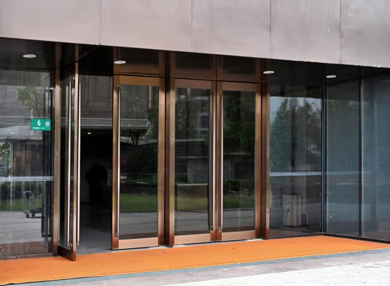 A glass door at the entrance to a commercial building