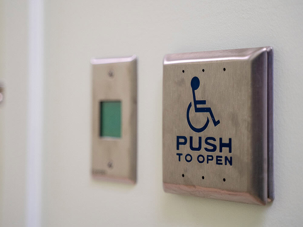 Push to open button on a door.