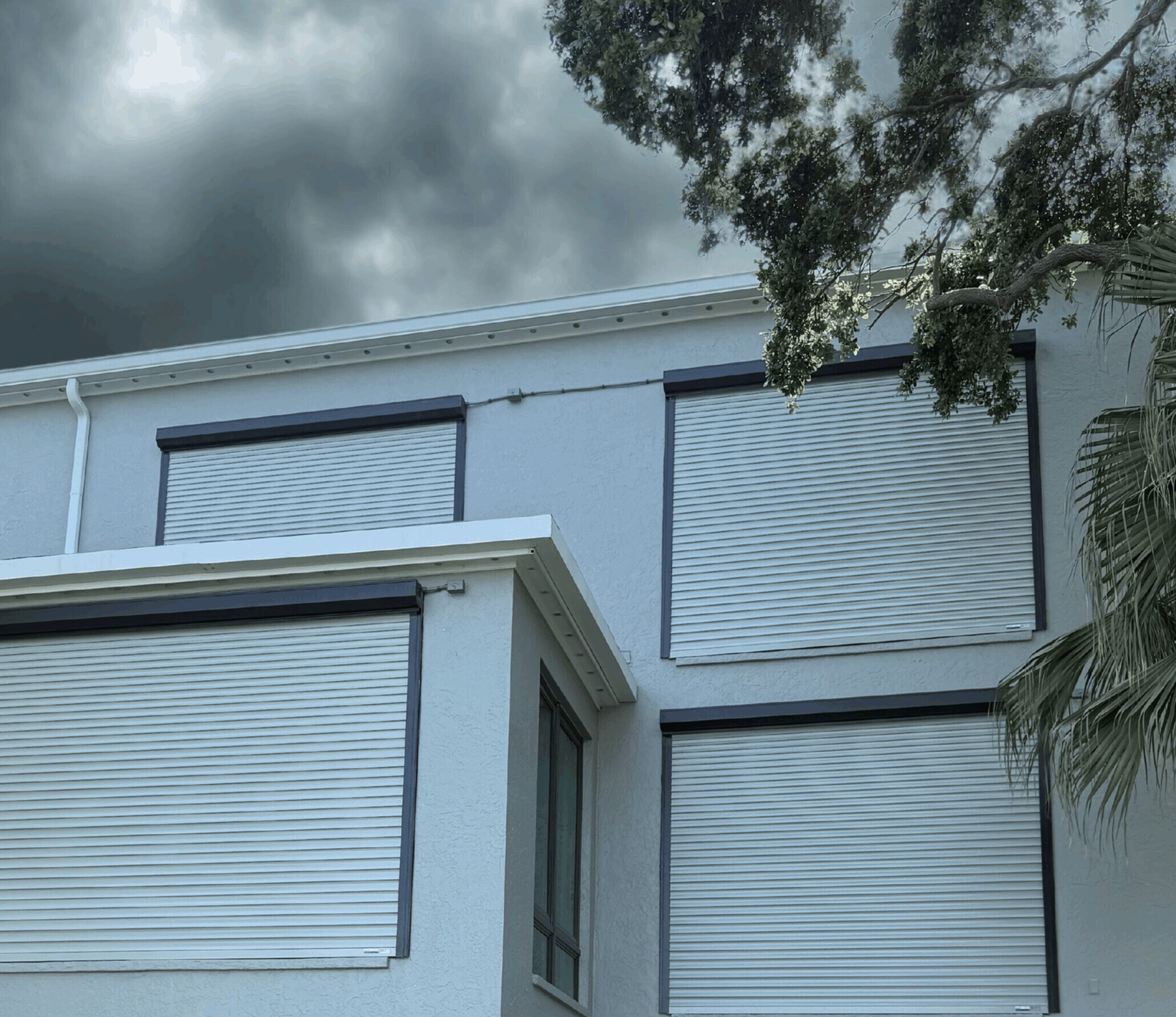 A building protected by roll-down hurricane shutters