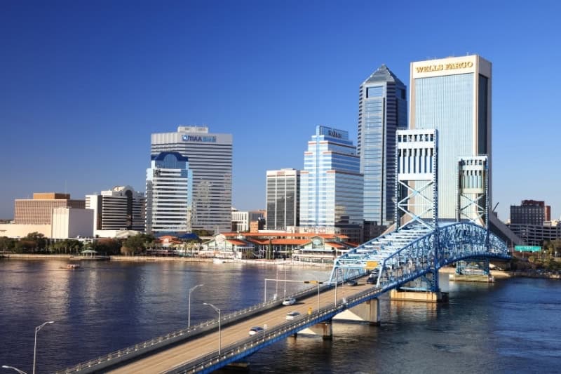Aerial view of Jacksonville, Florida skyline and brosge during the day overlooking the St. Johns River.